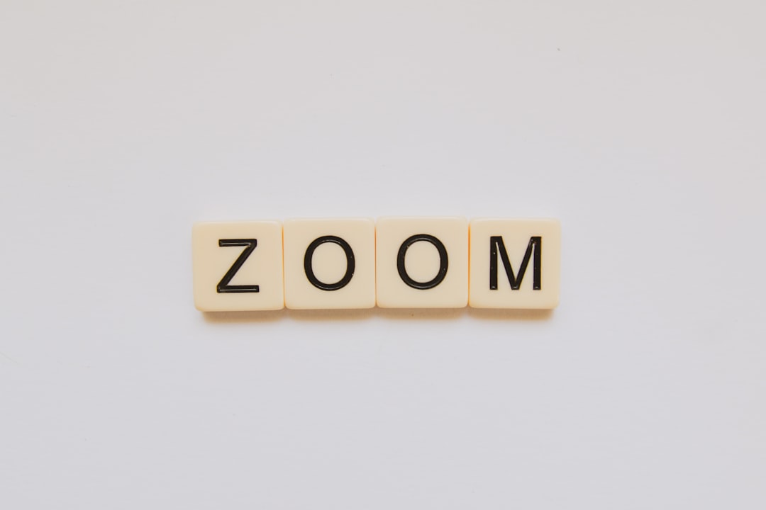 Zoom meeting screen showing AI transcription feature being disrupted by text spam